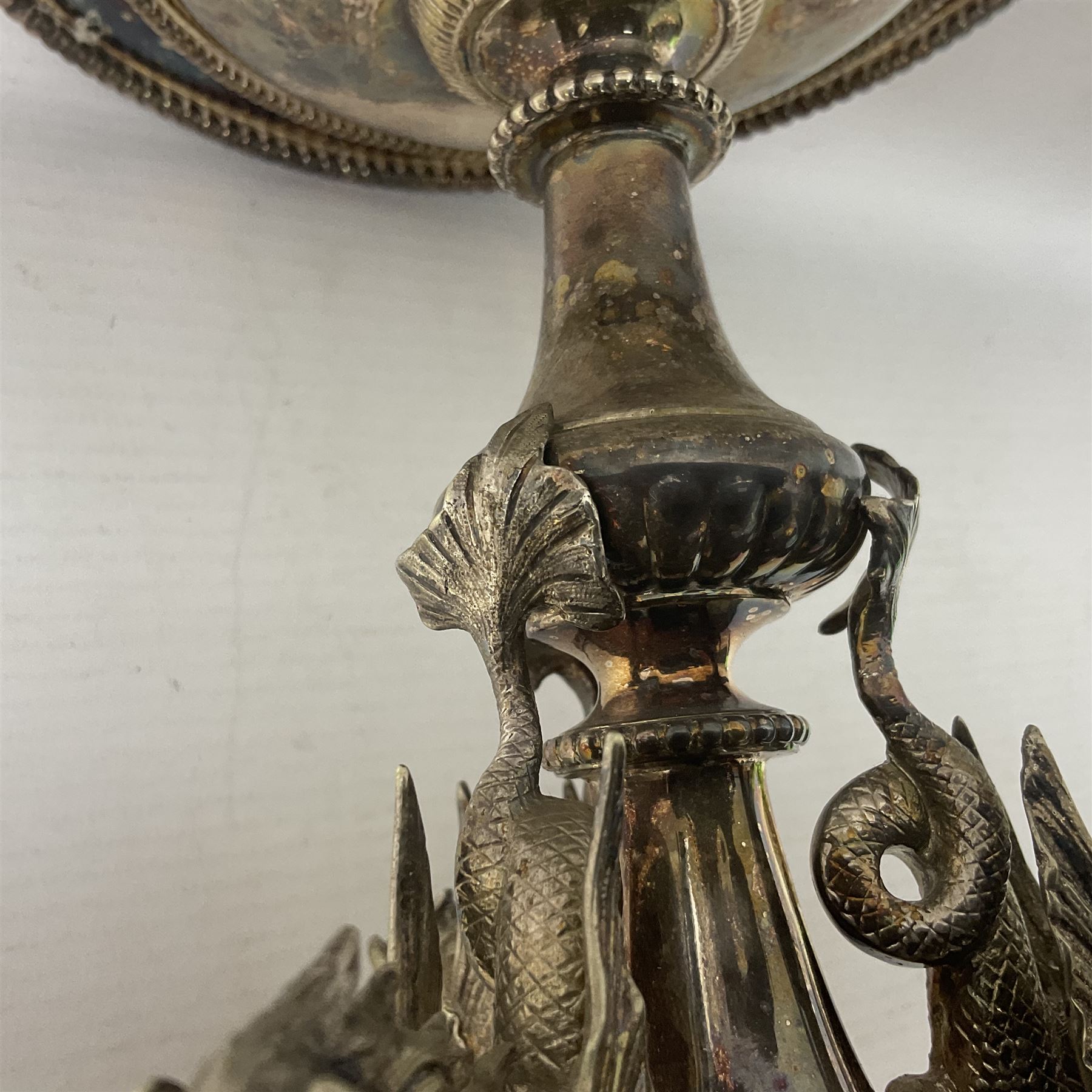 Silver plated centrepiece, with a triform base formed as three Hippocampus with beaded detail, numbered 3682 to the base, H18cm 