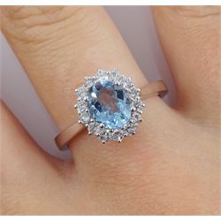 18ct white gold oval aquamarine and round brilliant cut cluster ring, hallmarked, aquamarine approx 1.05 carat, total diamond weight approx 0.40 carat