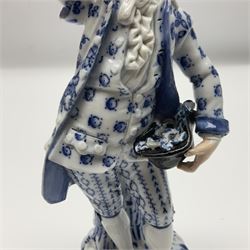 Meissen blue and white figure, modelled as a gentleman holding a hat of flowers, raised upon Greek key design base, with blue crossed swords and impressed C 73 and 149 marks beneath, H18cm