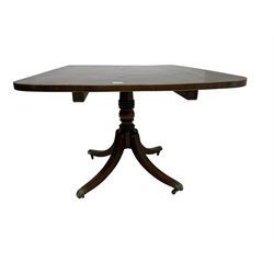 Regency mahogany breakfast table, rectangular banded tilt-top on turned column with four splayed supports, brass castors