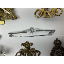 Collection of approximately sixty worldwide medals, metal badges, belt buckles, cloth badges, trench art, brass button stick etc