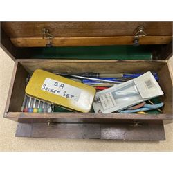 Six shelved cabinets for displaying ‘00’ gauge locomotives comprising plain plywood and white painted examples with track applied to various shelves, largest H63cm, W107cm, D27cm; Collection of tools for building model locomotives to include Weller PU-2D Soldering Pencil and Standard Tip Soldering Iron 20W/230V, Humbrol Modellers Airbrush, Power Supply Units and two wooden chests one of which housing a collection of tools including tweezers, scalping tools, wrenches etc 