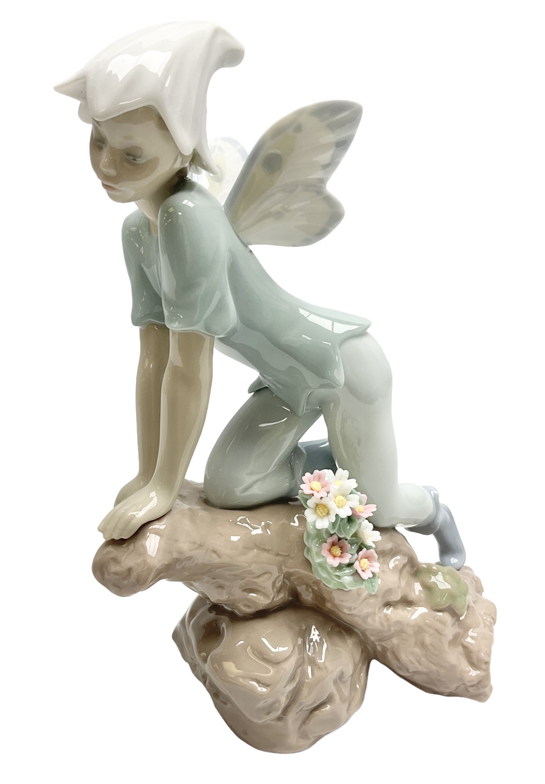 Lladro Privilege figure, Prince of Elves, modelled as an elf with wings leaning upon a rock, with original box, no 7690, sculpted by Joan Coderch, year issue 2001, year retired 2003, H23cm