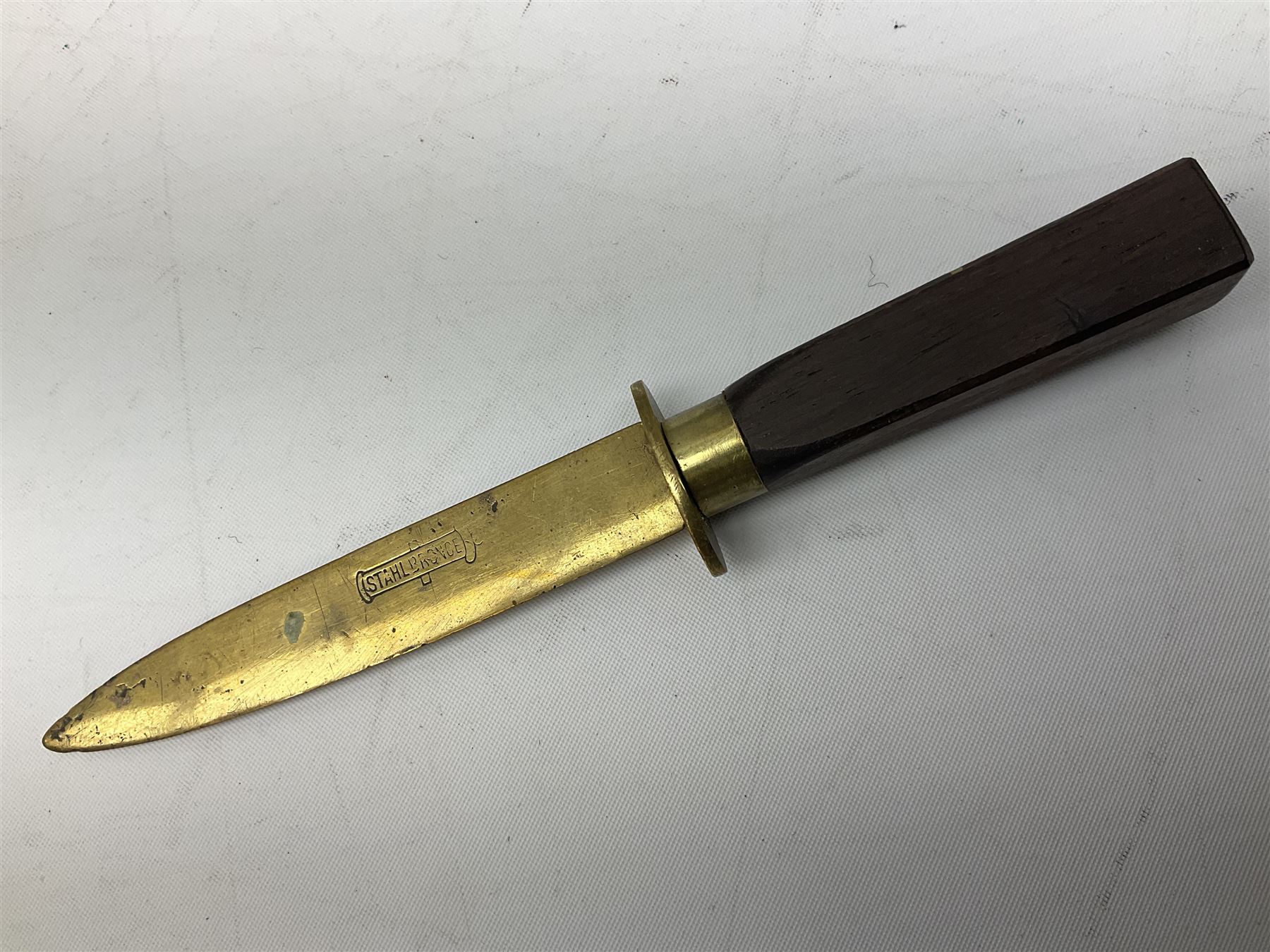 Malayan Kris dagger, the 31.5cm double edged straight heavy damascus blade with copper ferrule; carved hardwood grip; in large wooden throated scabbard with floral decorated white metal covering L47.5cm overall; a kris blade with adapted antler grip; and five various small daggers/letter openers (7)