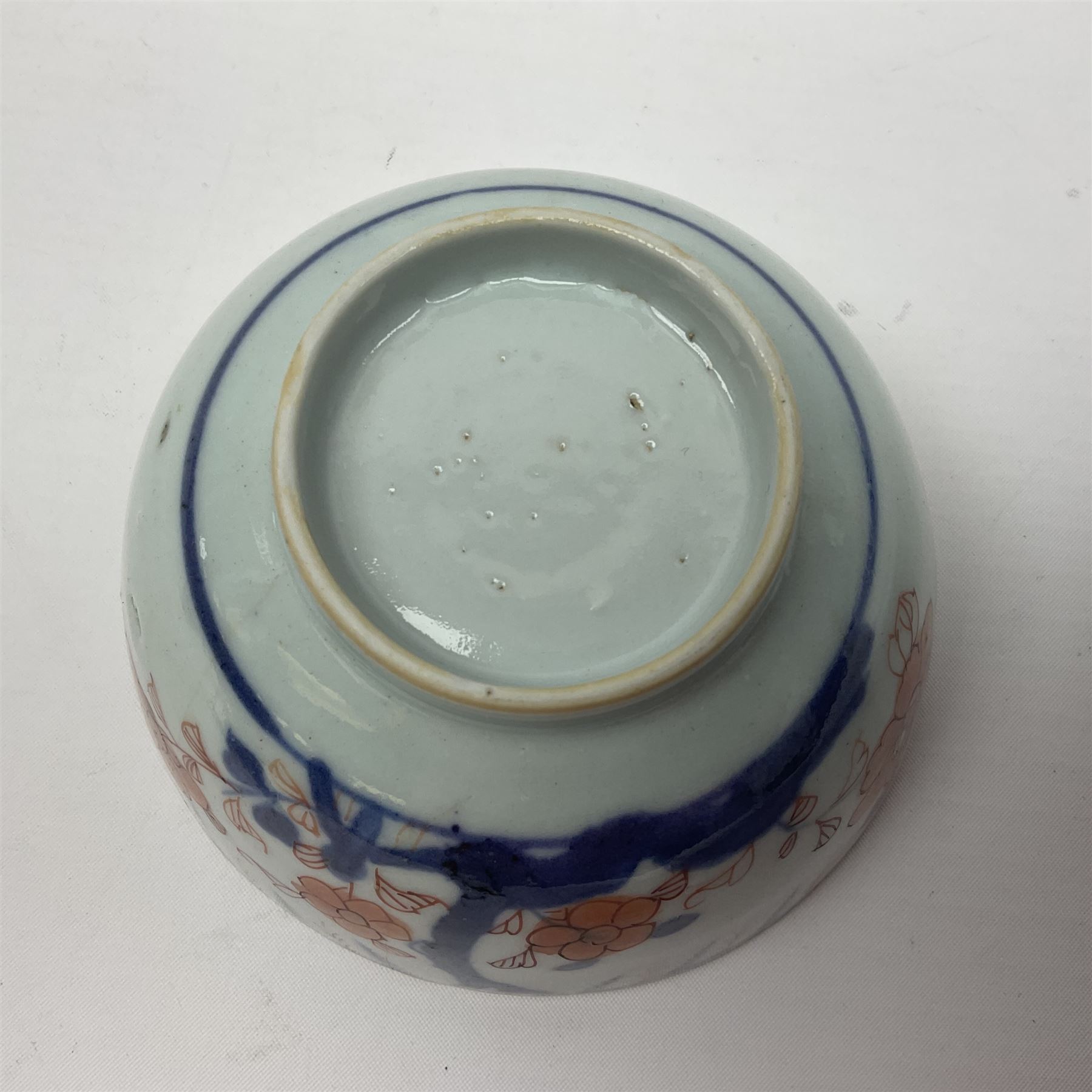 Chinese ceramic bowl, painted with floral and foliate decoration on a white ground, together with a similar much smaller Chinese bowl, painted with mountain scene to centre and covered by basket weave to exterior and a white metal mounted pear shaped scent bottle, largest bowl D11cm