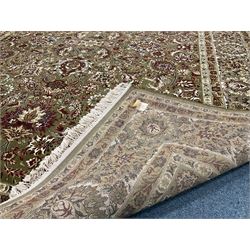 Persian design green ground carpet, central medallion with repeating border