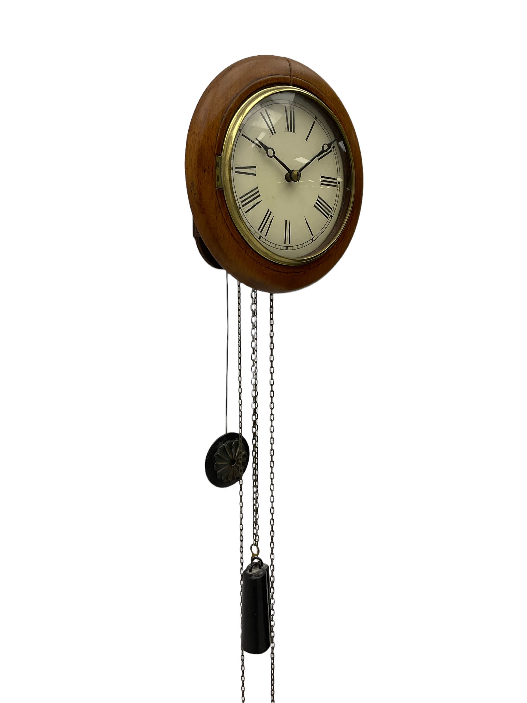 Small late 19th century German Bavarian wall clock c1880, 6” painted dial with Roman numerals, minute track and steel moon hands, cast brass bezel and flat glass with a mahogany surround, chain driven striking movement striking the hours on a bell, wooden plated movement with brass wheels and lantern pinions. With original pendulum and original weights.

