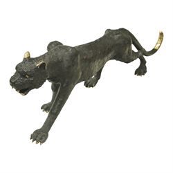 20th century bronze model of a panther, shown in prowling stance with head lowered and ext...