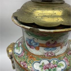 19th century Chinese Canton famille rose vase, converted to a table lamp, of shouldered cylindrical form, with twin gilt lion mask ring handles, the body decorated with four alternating panels of figural scenes and birds and insects, H31cm excluding fitting