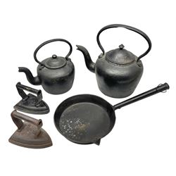 Two cast iron kettles to include Kenrick & Sobs 8 Pints example, cast iron pan and irons