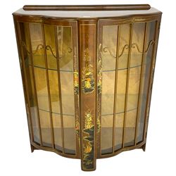 Early 20th century walnut display cabinet with Chinoiserie decoration, the shaped top over two glazed doors enclosing two glass shelves, decorated with raised gilt decoration depicting figures, landscapes and flowers
