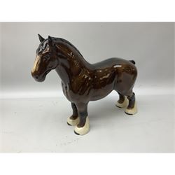 Five Beswick figures, comprising grey Shire horse no. 818, bay cantering Shire no.975, bay Burnham Beauty no. 2309 and two bay Shire horses no. 818, all with printed mark beneath 
