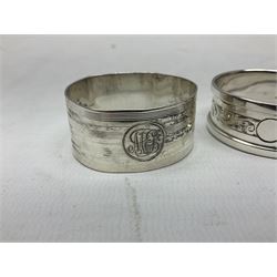 Pair of silver knife rests, (one a/f), and two silver napkin rings, approximate 84 grams, plus a silver plated Royal Commemorative napkin ring 