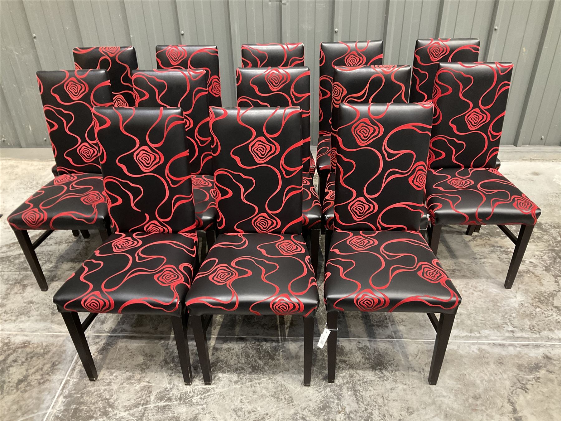 Thirteen high back restaurant dining chairs, upholstered in black faux leather with red embossed velvet - THIS LOT IS TO BE COLLECTED BY APPOINTMENT FROM DUGGLEBY STORAGE, GREAT HILL, EASTFIELD, SCARBOROUGH, YO11 3TX