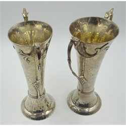  Two Art Nouveau beaten silver vases, floral design twin handles by Charles Edwards, London 1905/06, approx 20oz   