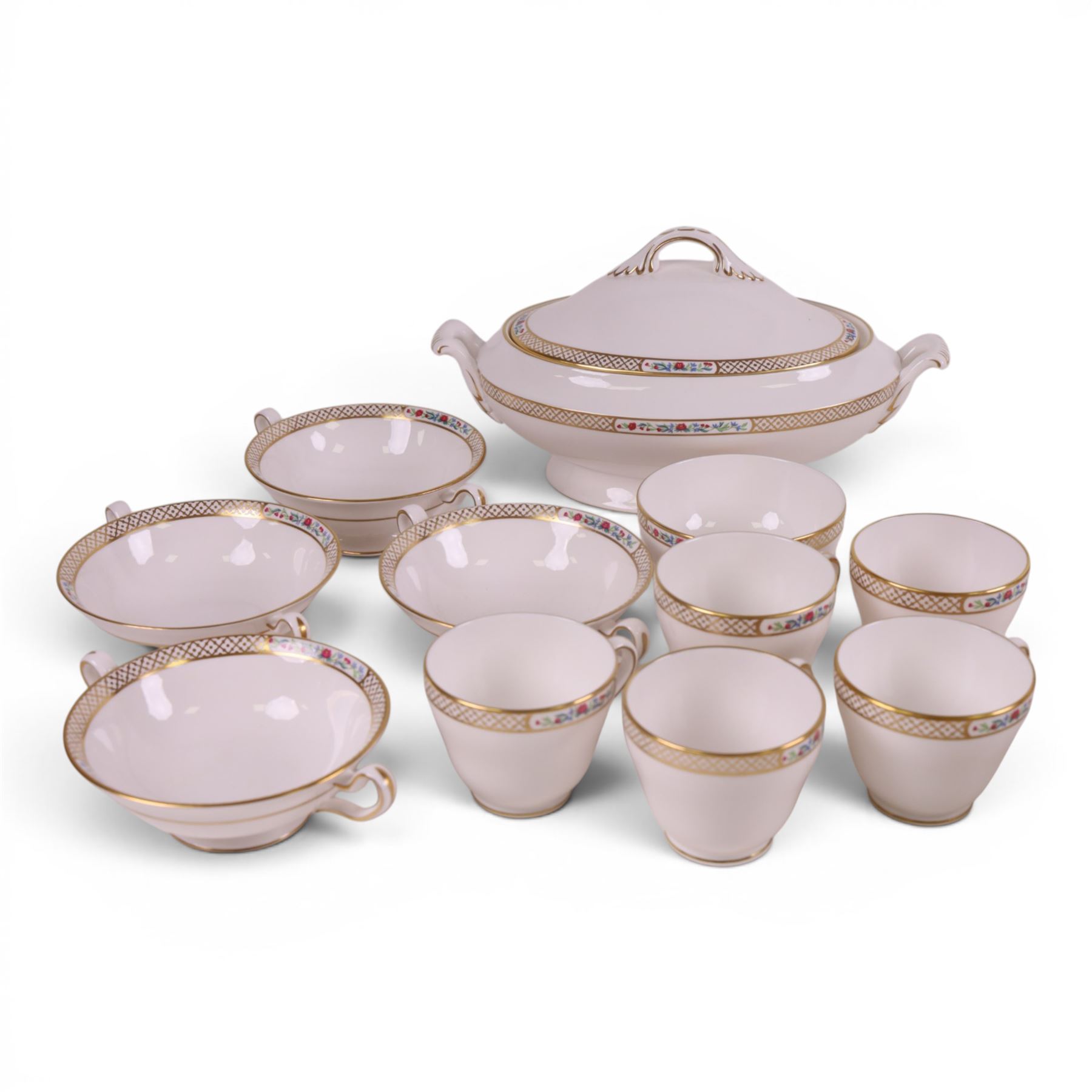 Spode Golden Trellis tea and dinner service for eight, including teapot, milk jug, open sucrier, teacups and saucers, dinner plates, soup bowls, side plates etc 