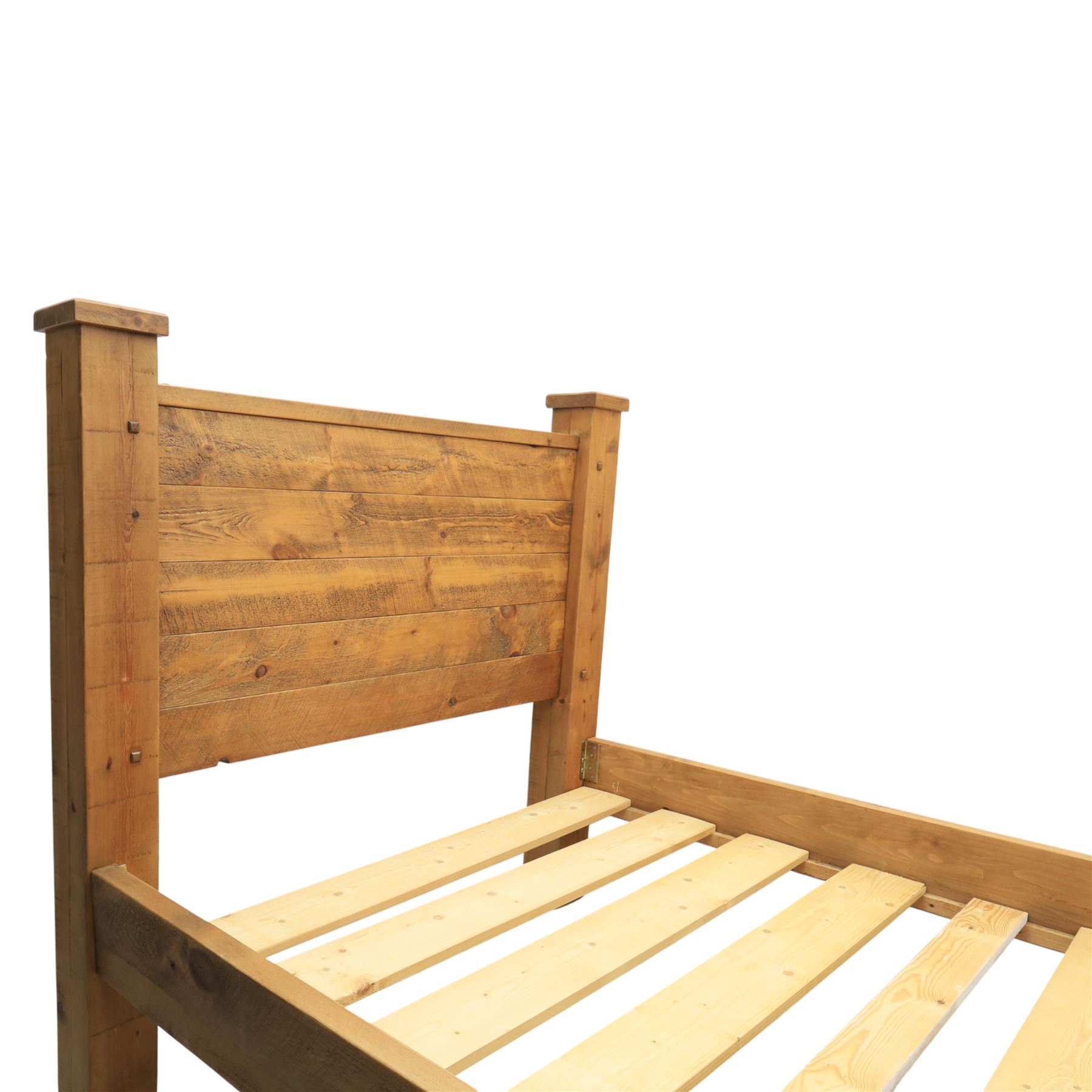 Alexander Ellis of Beverley - rustic pine king sized bed, of plank form construction with visible dowels, raised on stile supports