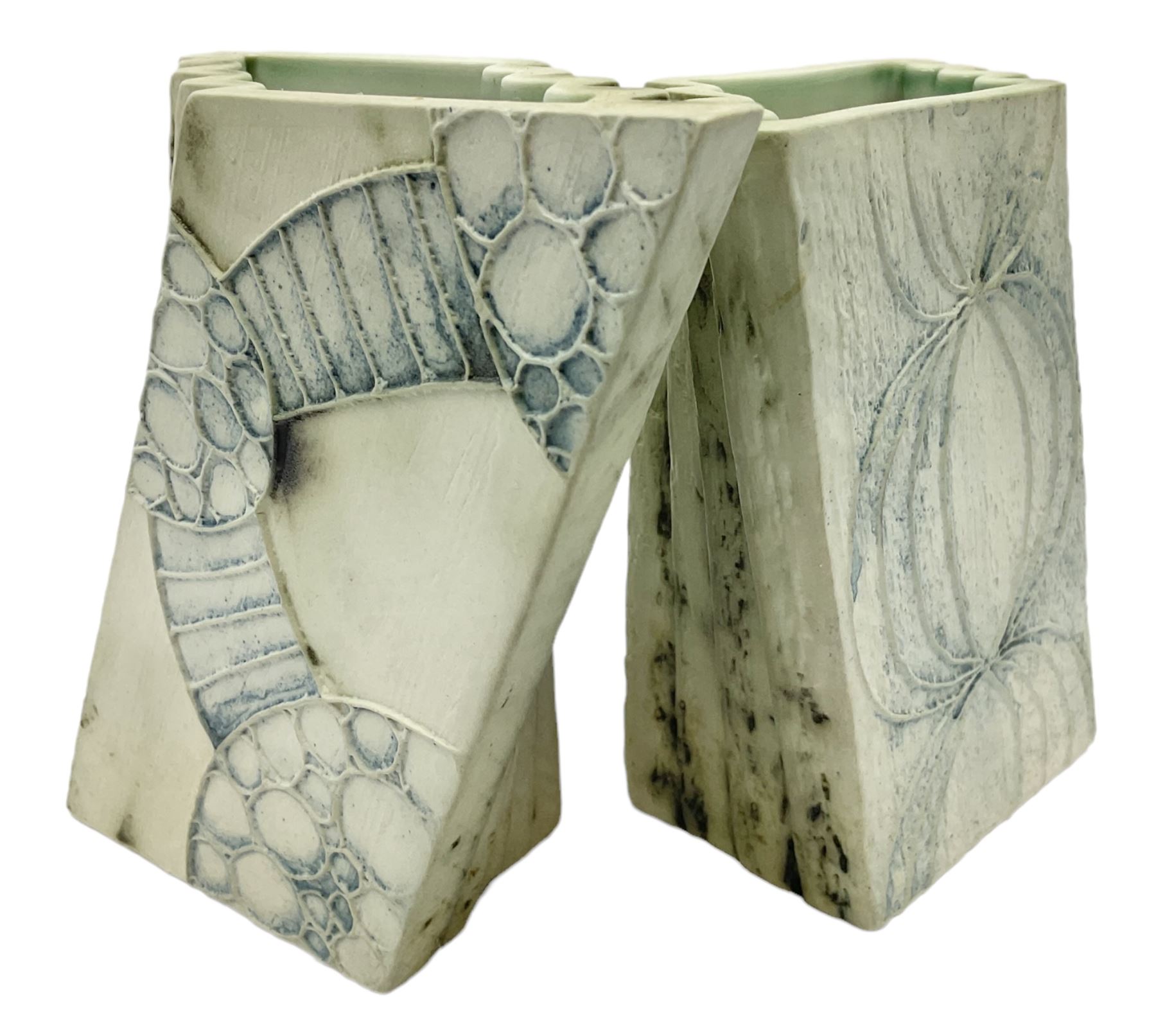 Pair of Carn Pottery Penzance vases of fan form, with tube lined floral and stylised decoration, stamped and marked X9 to base, H11.5cm