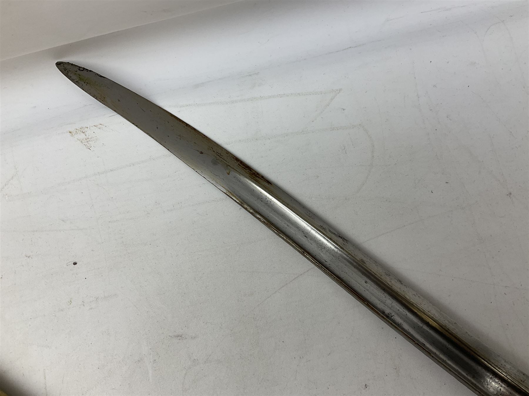 French Model 1866 sabre bayonet with 57cm fullered steel curving blade; in steel scabbard L71cm overall; another Model 1866 sabre bayonet lacking scabbard; and British Pattern 1856 sword bayonet (no scabbard) (3)