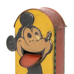 1930s Saalheimer & Strauss Mickey Mouse 'Smile Please' mechanical tin plate money box, depicting Mickey Mouse posing with folded hands to the front and verso as a photographer, above the motto 'If you only pull my ear you will see my tongue appear. Place a coin upon my tongue save your money while you're young', marked to one side 'By exclusive arrangement with Ideal Films Ltd. All rights reserved. Registered No 508041', with key, H17cm

