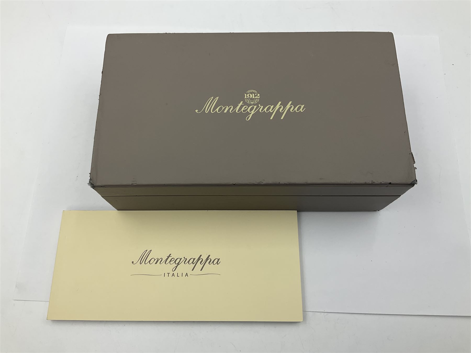 Montegrappa Emblema fountain pen, the blue pearl marbled barrel of octagonal form with silver mounts stamped 925 and silver mounted cap with 1912 emblem and clip with roller, in box, L13.5cm