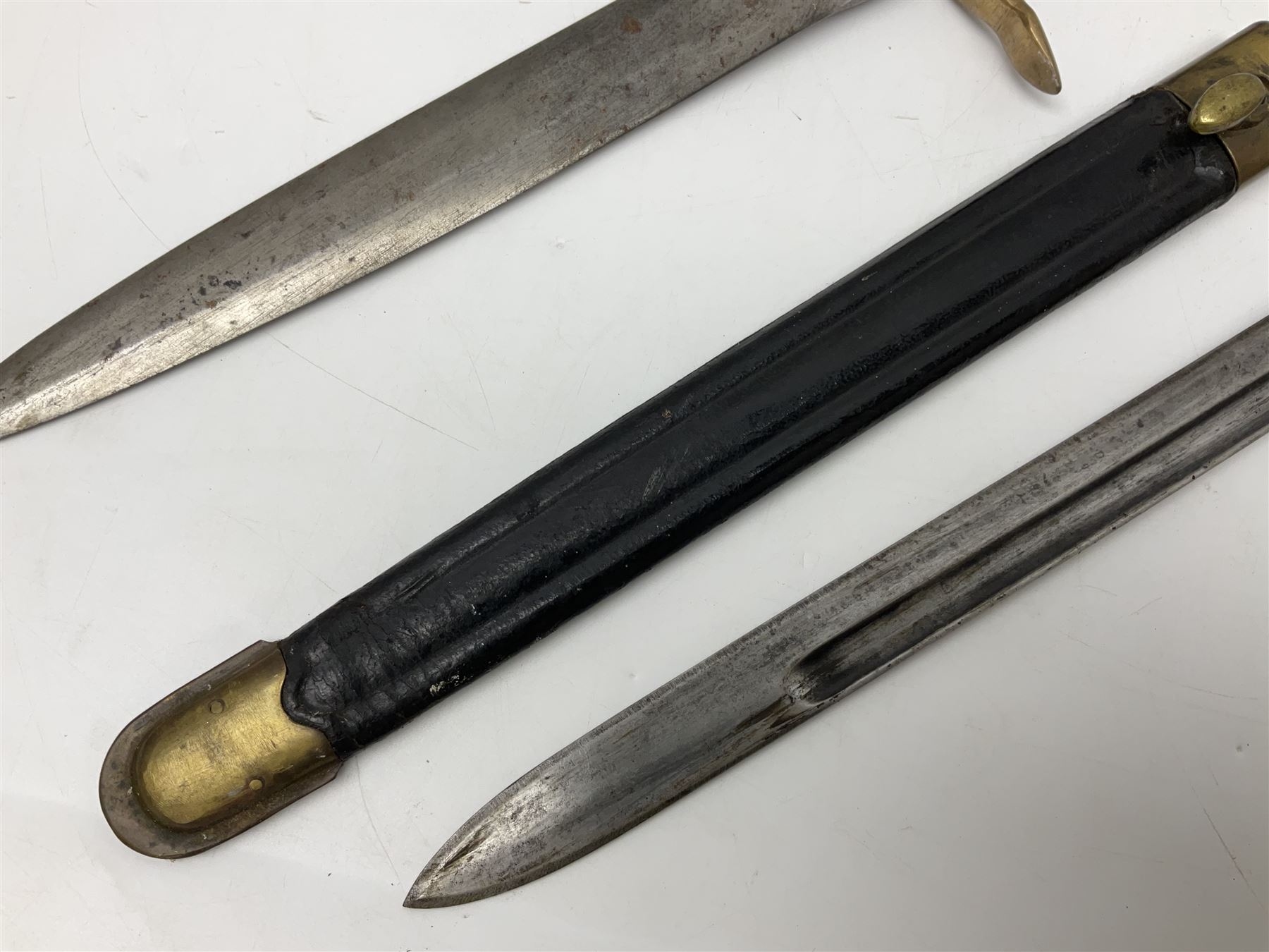 Italian Model 1891 bayonet with 30cm fullered blade; the crosspiece marked 'TERNI'; in associated brass and leather scabbard L43cm overall; and Knights Templar (?) short blade sword (no scabbard) (2)