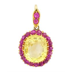 Gold yellow sapphire and ruby pendant, single cushion cut sapphire of approx 10.20 carat, ...