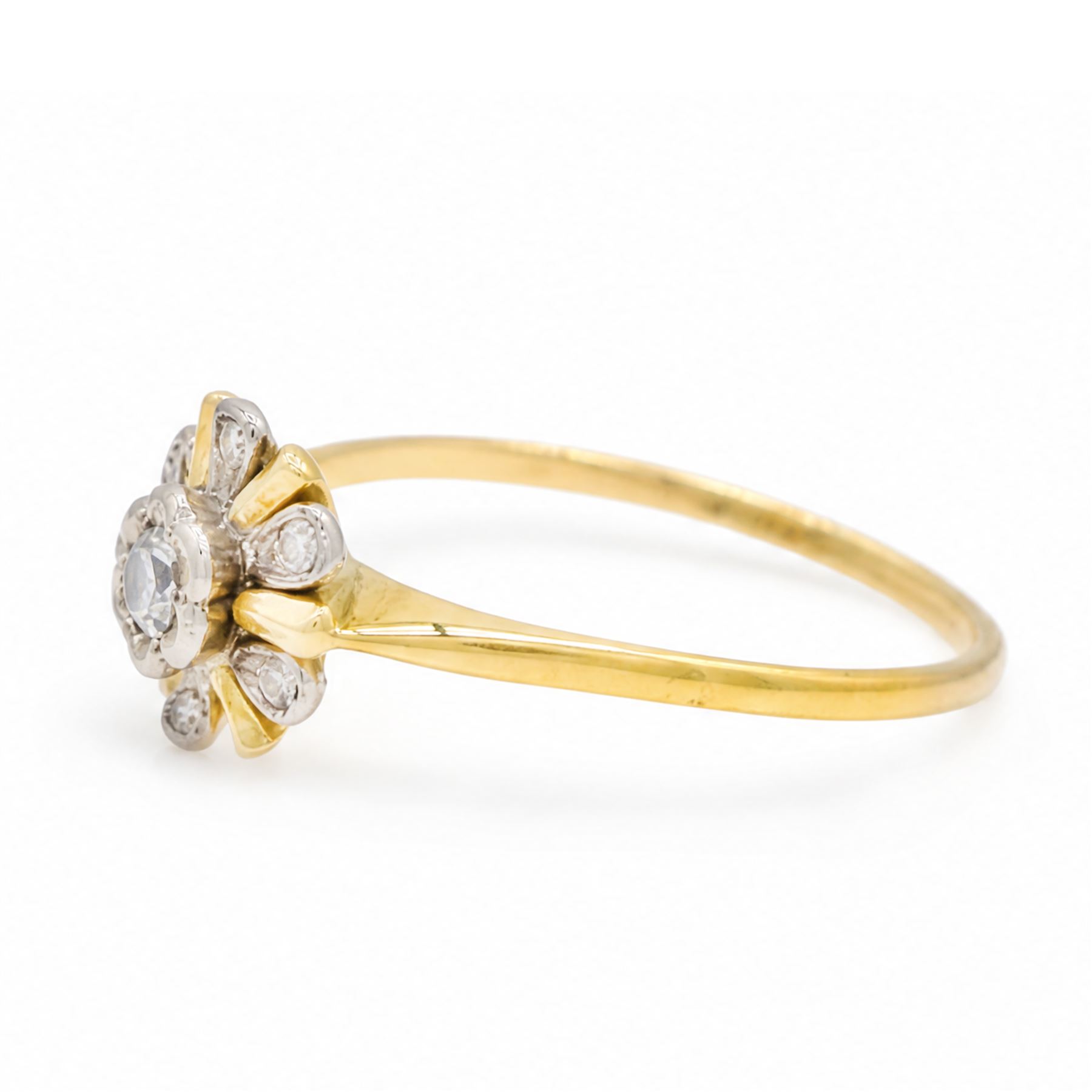 18ct gold diamond flower head cluster ring, round brilliant cut diamond surrounded by six single cut diamonds 