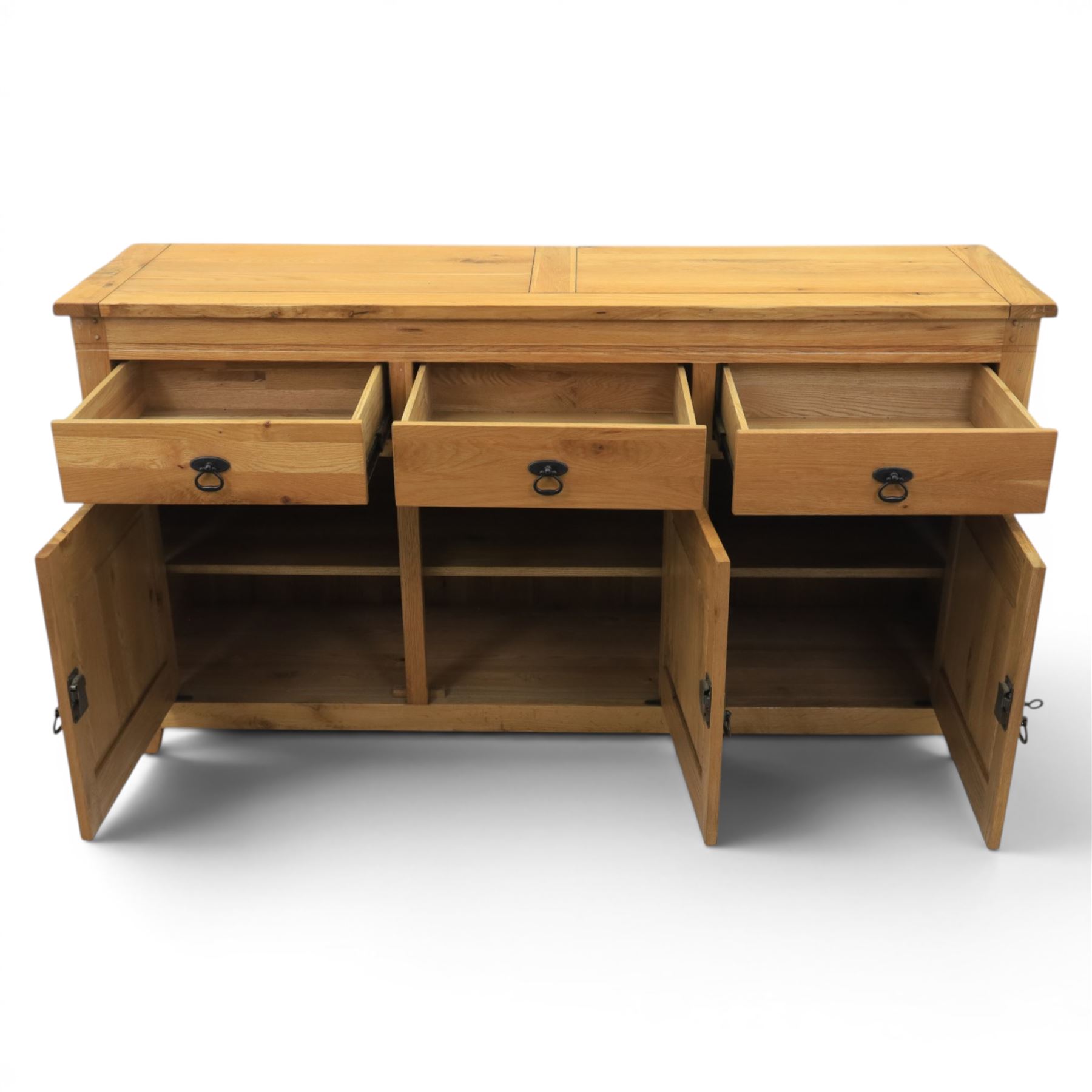 Contemporary oak sideboard, with rectangular top above three drawers and three cupboard doors, blackened metal handles, raised on stile supports