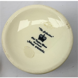 An Old Tupton Ware honey pot, of oval form with tube lined tendril decoration, the domed cover surmounted by a honey bee, with accompanying spoon, together with a pair of Old Tupton Ware vases, with tube lined sunflower decoration, H22cm, each with printed mark to base.