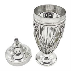 Early 20th century silver sugar caster, of open work urn form with ribbon swag detail and clear glass liner, the removable pierced cover with flambeau finial, upon a circular spreading foot, hallmarked Haseler Brothers, London 1910, H17.5cm, approximate silver weight 5.56 ozt (173 grams)