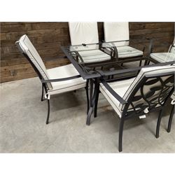 Metal framed garden table with glazed top (W170cm, D102cm, H71cm) and six armchairs with cushions 