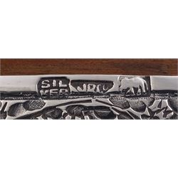 Indian silver cigarette box, of rectangular form with chassed and embossed foliate decoration and vacant rectangular panel to hinged cover, opening to reveal softwood lined interior with division, H3.3cm W14.3cm D8.5cm, stamped Silver VR Co with elephant mark