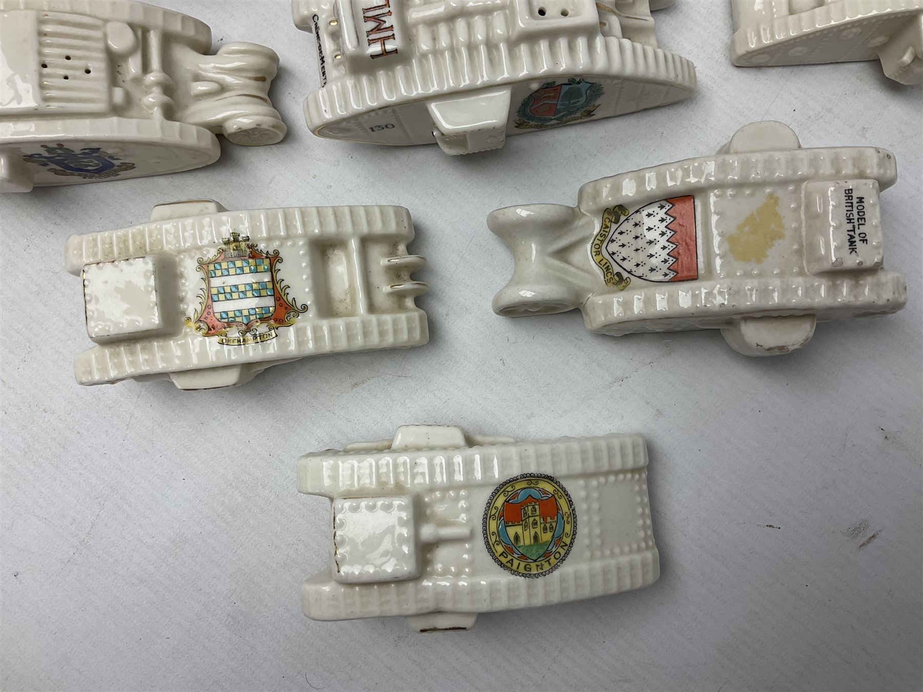 Twelve crested china models of WW1 tanks by Grafton, Arcadian and Carlton china etc with crests from Caistor Lincs, Saffron Walden, Paignton, Evesham etc  , together with a crested china model of the R.M.S Lusitania with New Brighton crest and a two-handled vase for 'The Forts Boxhill' (14)