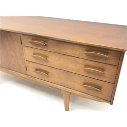 Mid 20th century teak sideboard, three graduating drawers, two cupboard doors, tapering supports, W168cm, H75cm, D45cm

