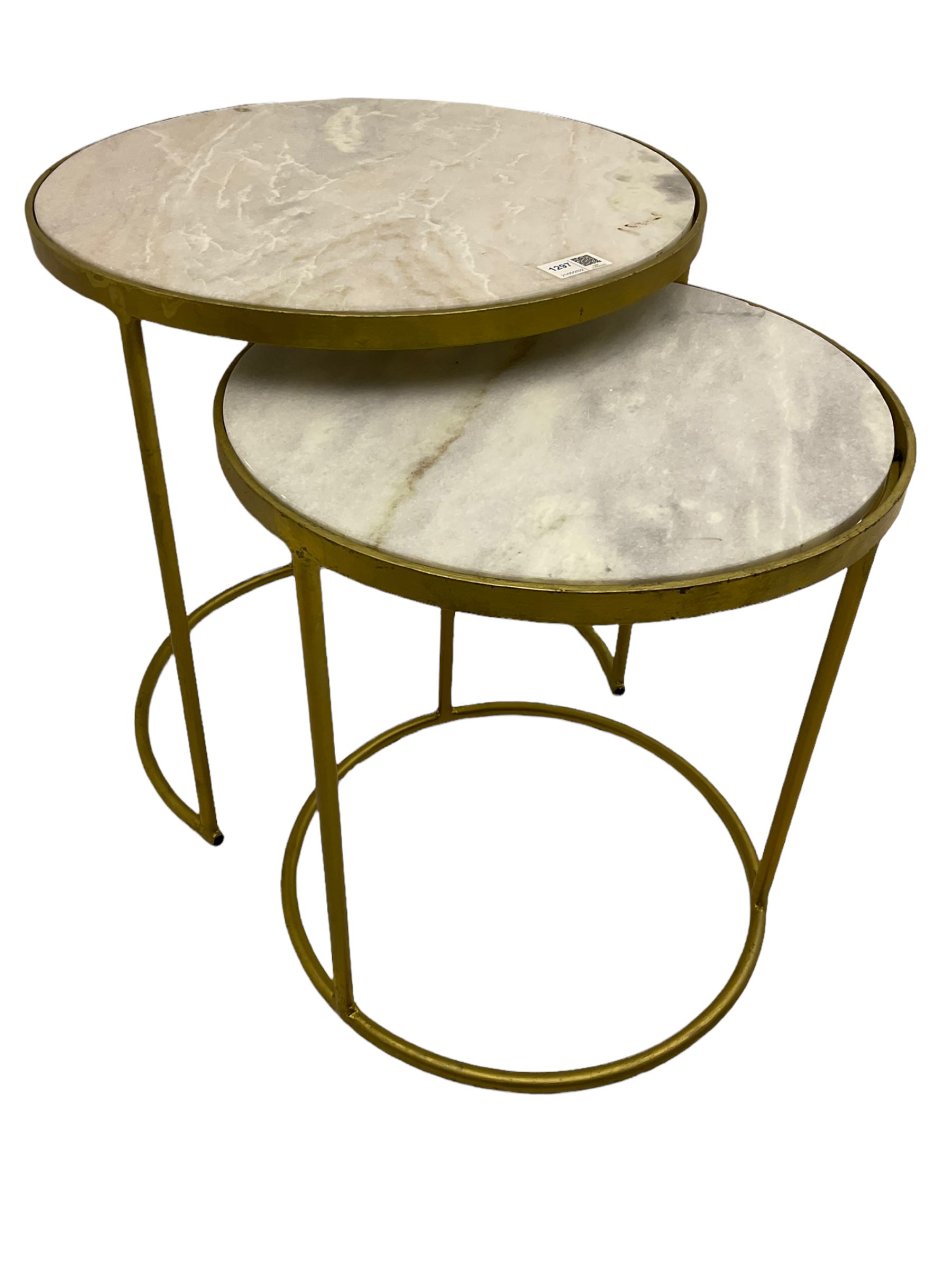 Two contemporary nesting side tables, circular gilt metal frames with