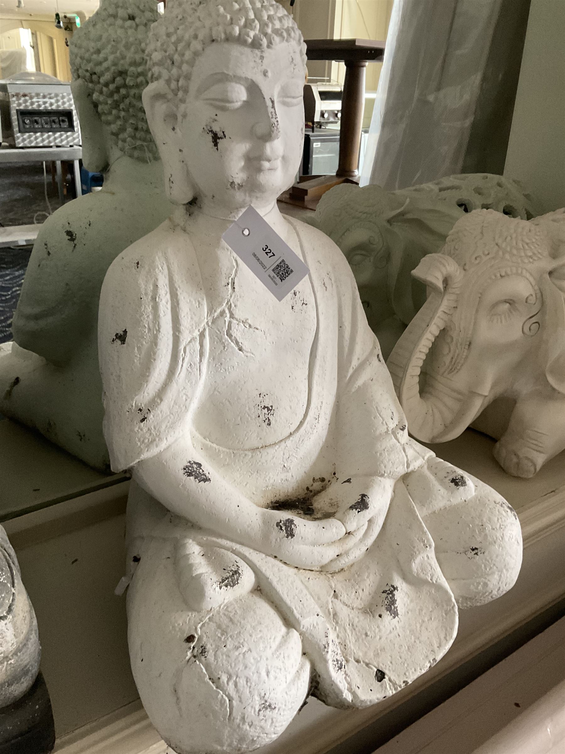 Three cast seated Buddhas and an elephant (4)- LOT SUBJECT TO VAT ON THE HAMMER PRICE - To be collected by appointment from The Ambassador Hotel, 36-38 Esplanade, Scarborough YO11 2AY. ALL GOODS MUST BE REMOVED BY WEDNESDAY 15TH JUNE.