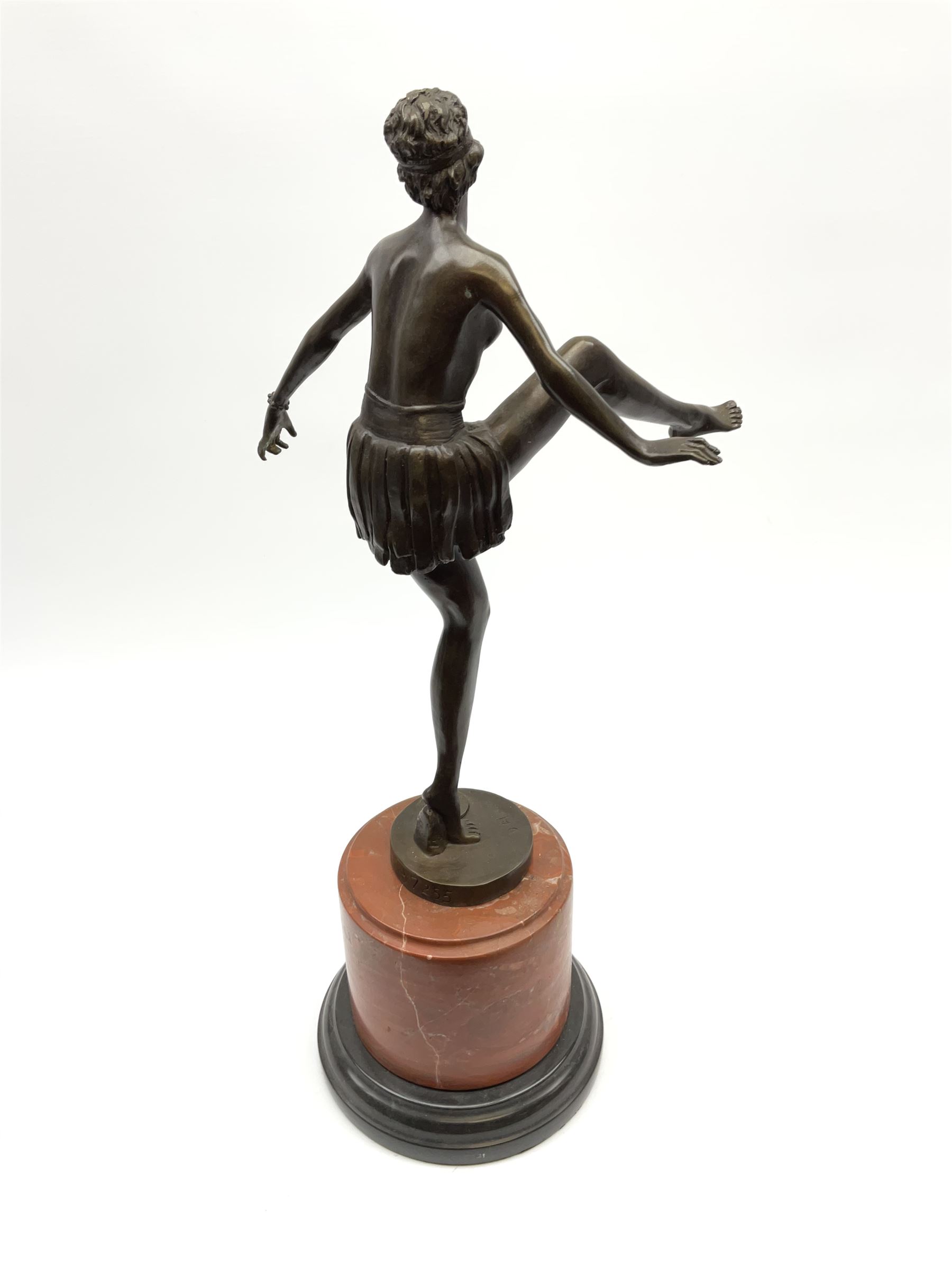 An Art Deco style bronze after D Alonzo, modelled as a dancer, with impressed mark and foundry mark, raised upon a cylindrical marble base, overall H47.5cm. 