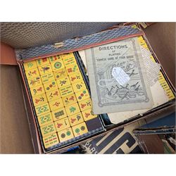 Collection of early 20th century games, to include Escalado (Chad Valley), cased Mahjong, Bezique, the case with hallmarked silver clasp, Autobridge and Kan-U-Go, Waddington's vintage games including Scoop! and Cluedo etc in two boxes