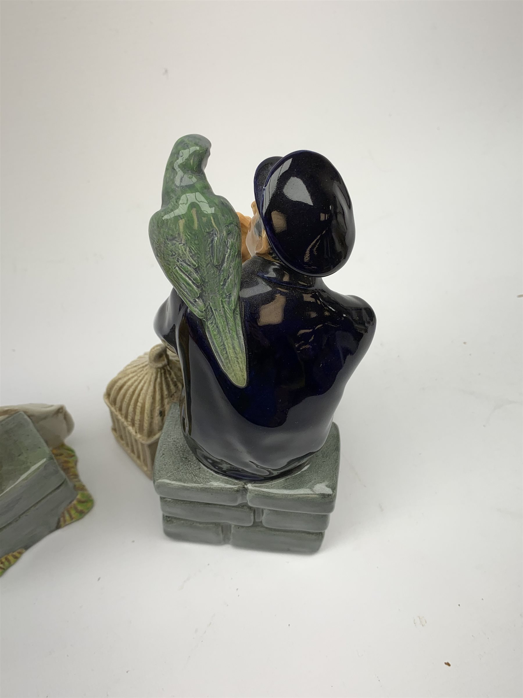 Two Royal Doulton figurines,  The Boatman HN2417, and Shore Leave HN2254, each with green printed mark beneath.