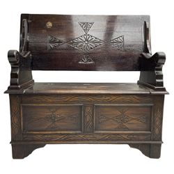 17th century design stained oak monks bench, hinged metaphoric table back, over hinged box seat compartment, the panelled front carved with foliate decoration and lozenges
