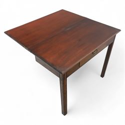 Georgian mahogany fold-over tea table, rectangular top with moulded edge over single frieze drawer with brass handle plate, on square tapering supports with gateleg
