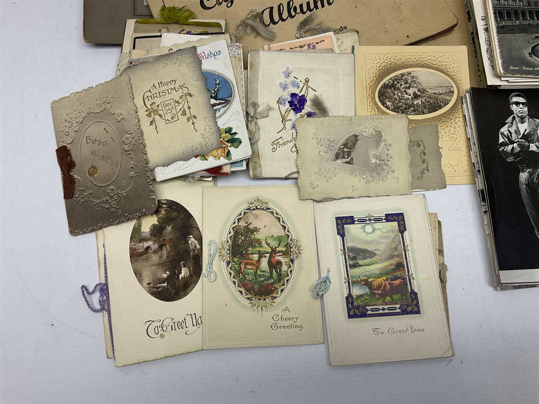 Two albums of cigarette cards, including Carreras Alice in Wonderland examples, together with vintage greetings cards, postcards, theatre stills, etc