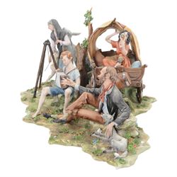 Capodimonte figural group of a gypsy encampment including wagon, cooking fire and people, H21cm