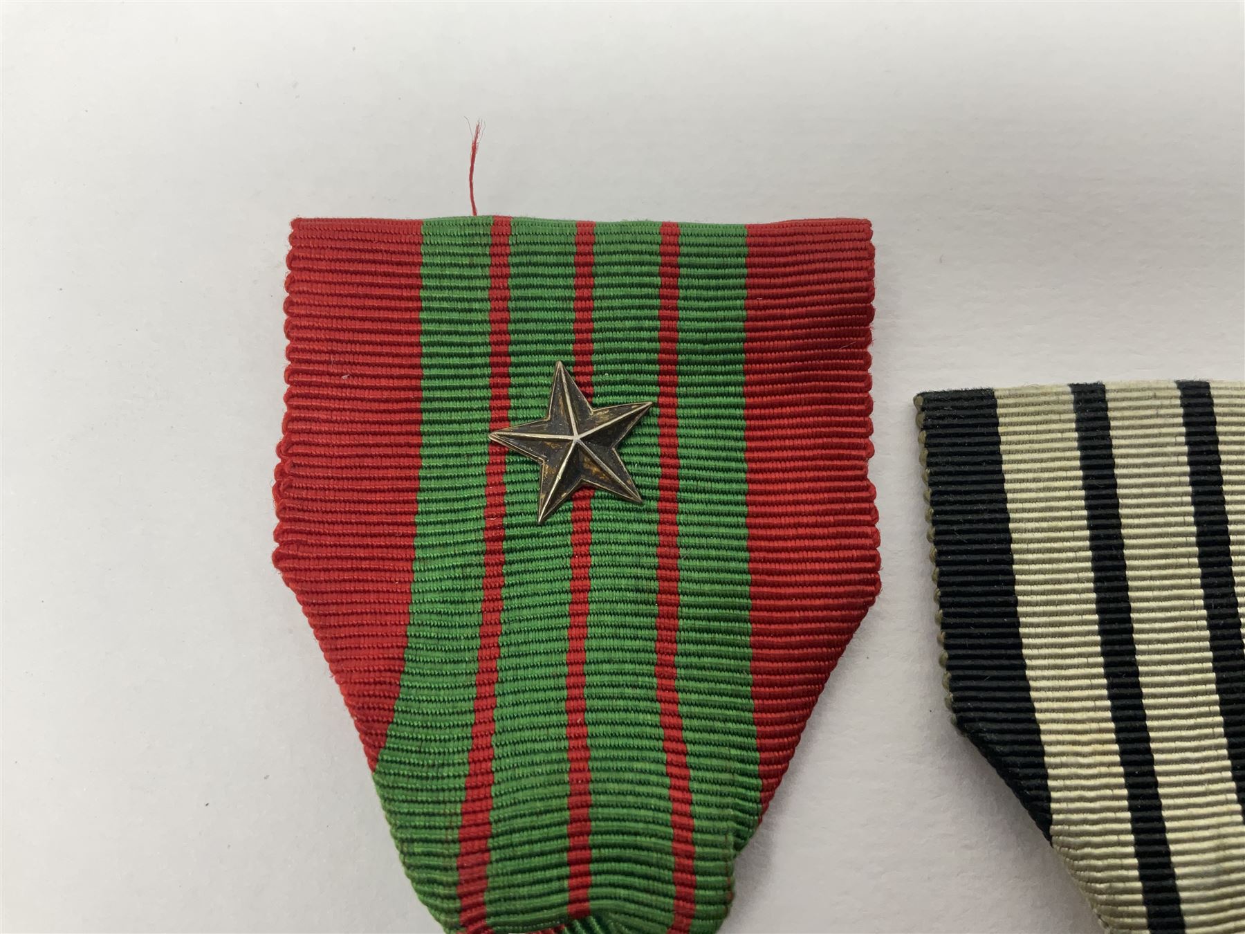 Four French medals - St. Helena medal with bust of Napoleon to obverse and inscription to reverse 'Campagnes de 1792 a 1815. A ses compagnons de gloire sa derniere pensée Ste. Hélène 5 Mai 1821', established by Emperor Napoleon III in 1857; two WW2 Croix-de-Guerre; and WW2 Croix-du-Combattant; all with ribbons (4)