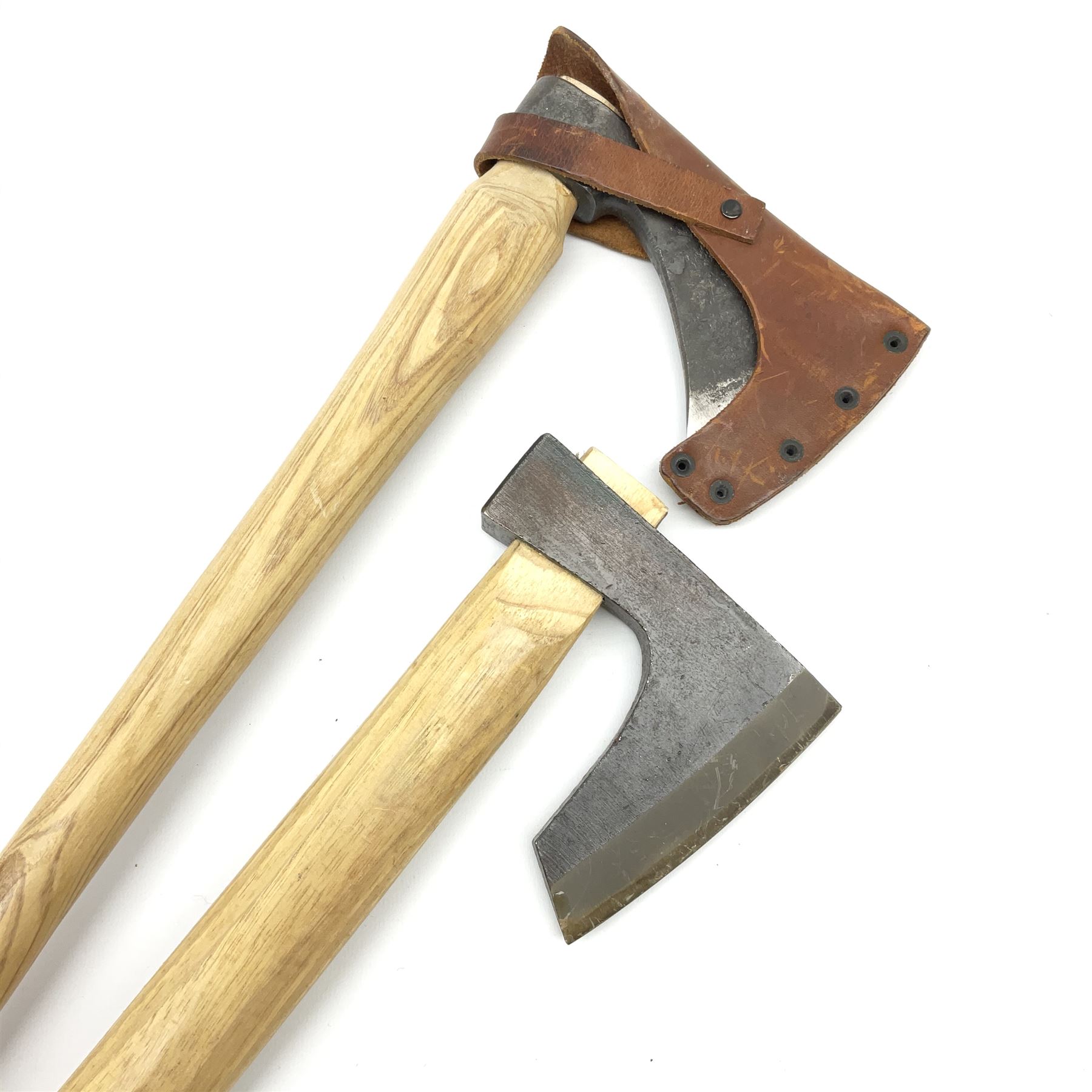 Swedish hunting axe the head marked Gransfors-Bruk, the ash handle with bun pommel and leather head cover, L45cm; and another similar unmarked hunting axe (2)
