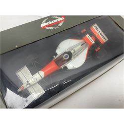 Three Paul's Model Art 1:18 scale die-cast McLaren racing cars - Mercedes MP4/11 D. Coulthard; MP4/4 A. Prost; and Mercedes MP4/10 M. Hakkinen; all boxed (3)