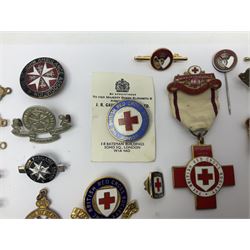 Collection of St John Ambulance enamel and metal badges, together with Red Cross medals and badges