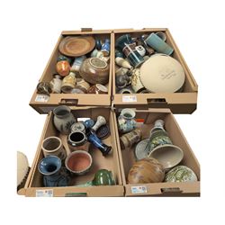 Collection of studio pottery, including bowls, vases, goblets and bottles, in four boxes 