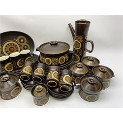 Denby Arabesque patter tea and dinner wares, comprising six dinner plates, twelve side plates, six twin handled bowls and covers, two tureen and covers, four oval serving platters, coffee pot, water jug, milk jug, cream jug, sucrier and cover, and eight coffee cans. 